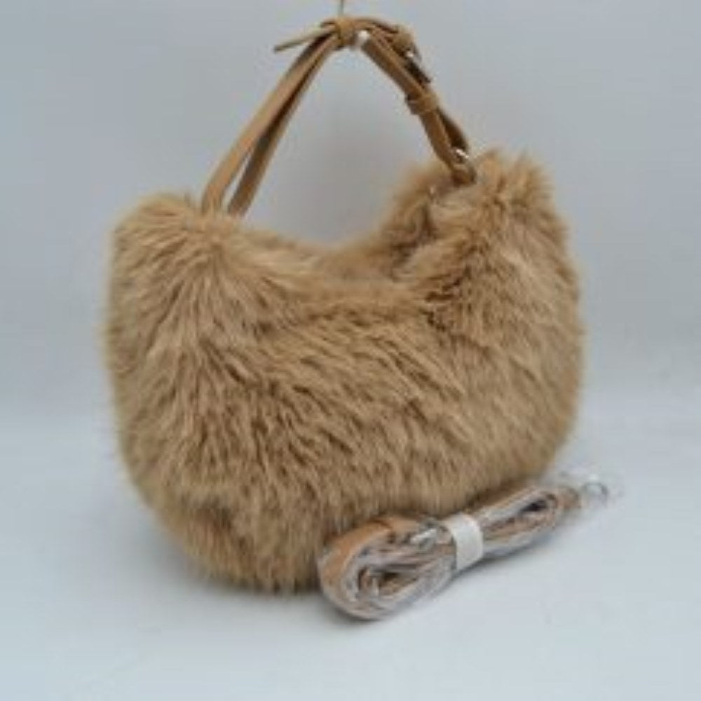 Taupe This unique everyday handbag showcases a soft, high-pile plush exterior that brings a cozy, textured aesthetic to your accessory collection. Designed in a relaxed hobo silhouette, it features a central main storage compartment to keep your daily items easily accessible. For versatile carrying options, the bag is equipped with an adjustable top handle attached to metallic rings, alongside an additional detachable shoulder strap.