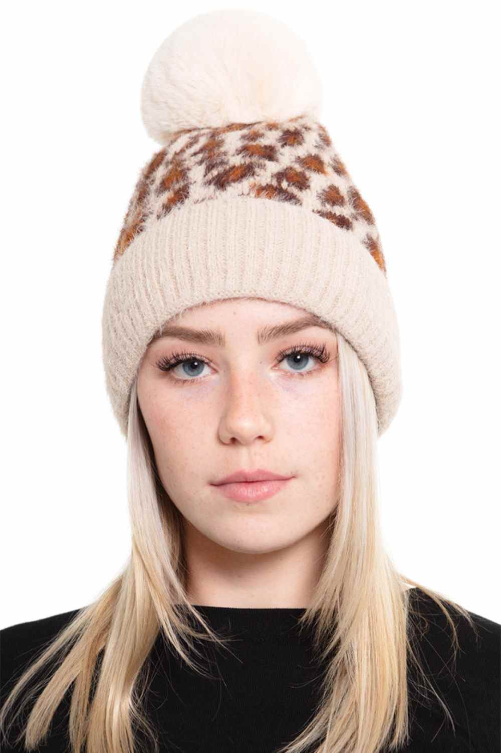 Taupe Cozy up in this Leopard Pom Fleece Beanie, featuring a playful leopard print design with a fuzzy pom-pom on top. Made from a soft blend of 50% acrylic and 50% nylon, this beanie delivers warmth and comfort for chilly days.