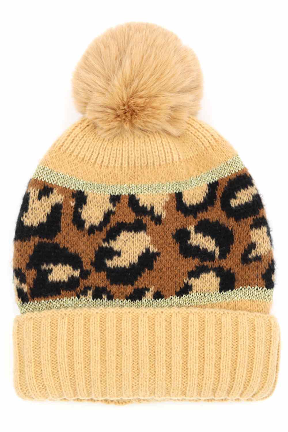 Taupe Leopard PomPom Beanie features a bold leopard print design topped with a fluffy pompom for a trendy, winter-ready look. Made with a soft stretch fit, it delivers cozy warmth while adding stylish flair to your cold-weather outfits.