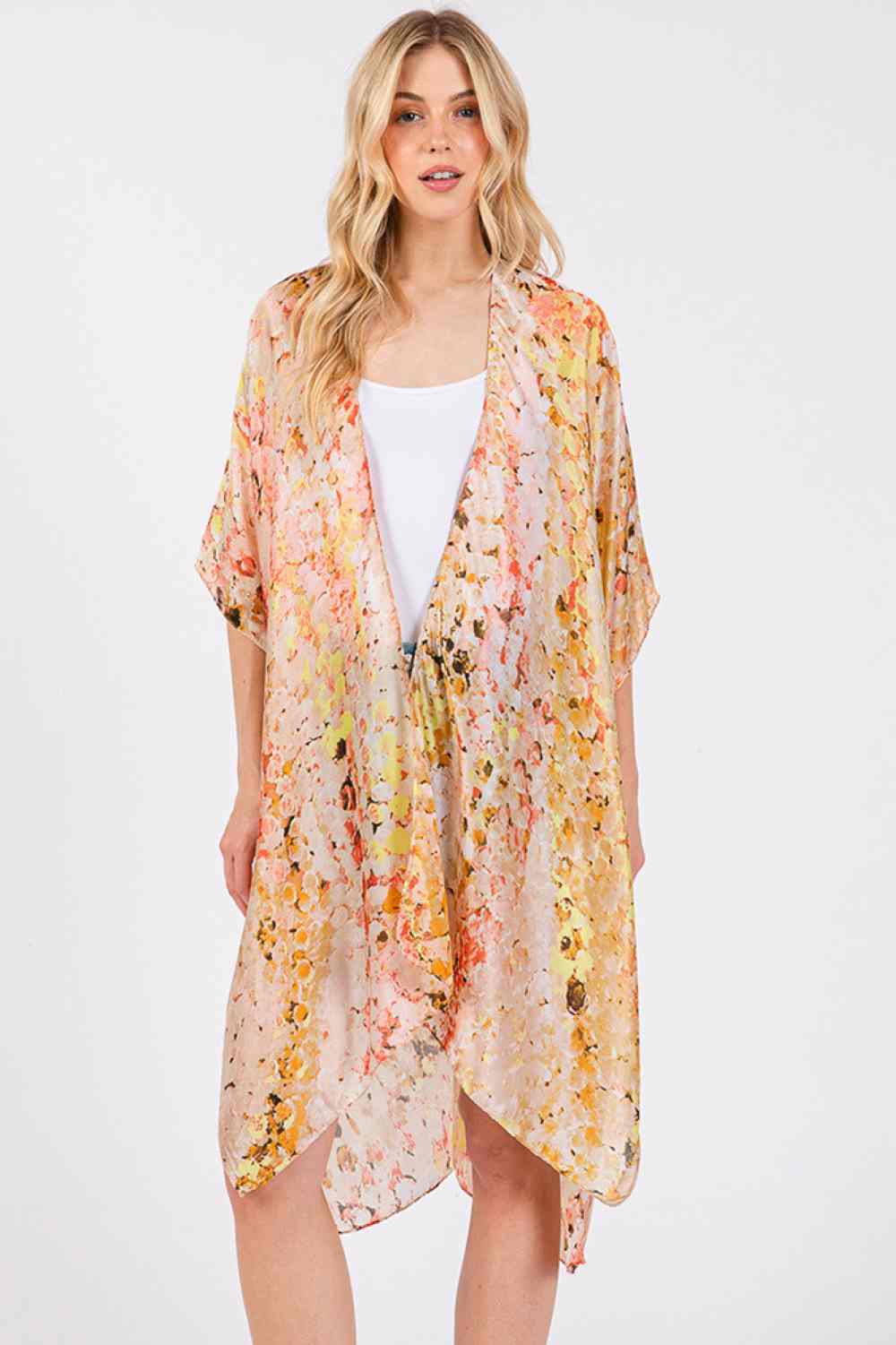 Taupe Effortless elegance meets summer style with this multi-color abstract pattern kimono cover-up. Crafted from 100% polyester with a luxuriously silky feel, it drapes beautifully over swimwear or casual outfits. The vibrant abstract design adds visual interest to any beach or resort look. Measuring 35" x 36", it offers comfortable coverage without bulk. Perfect for layering during warm weather adventures.