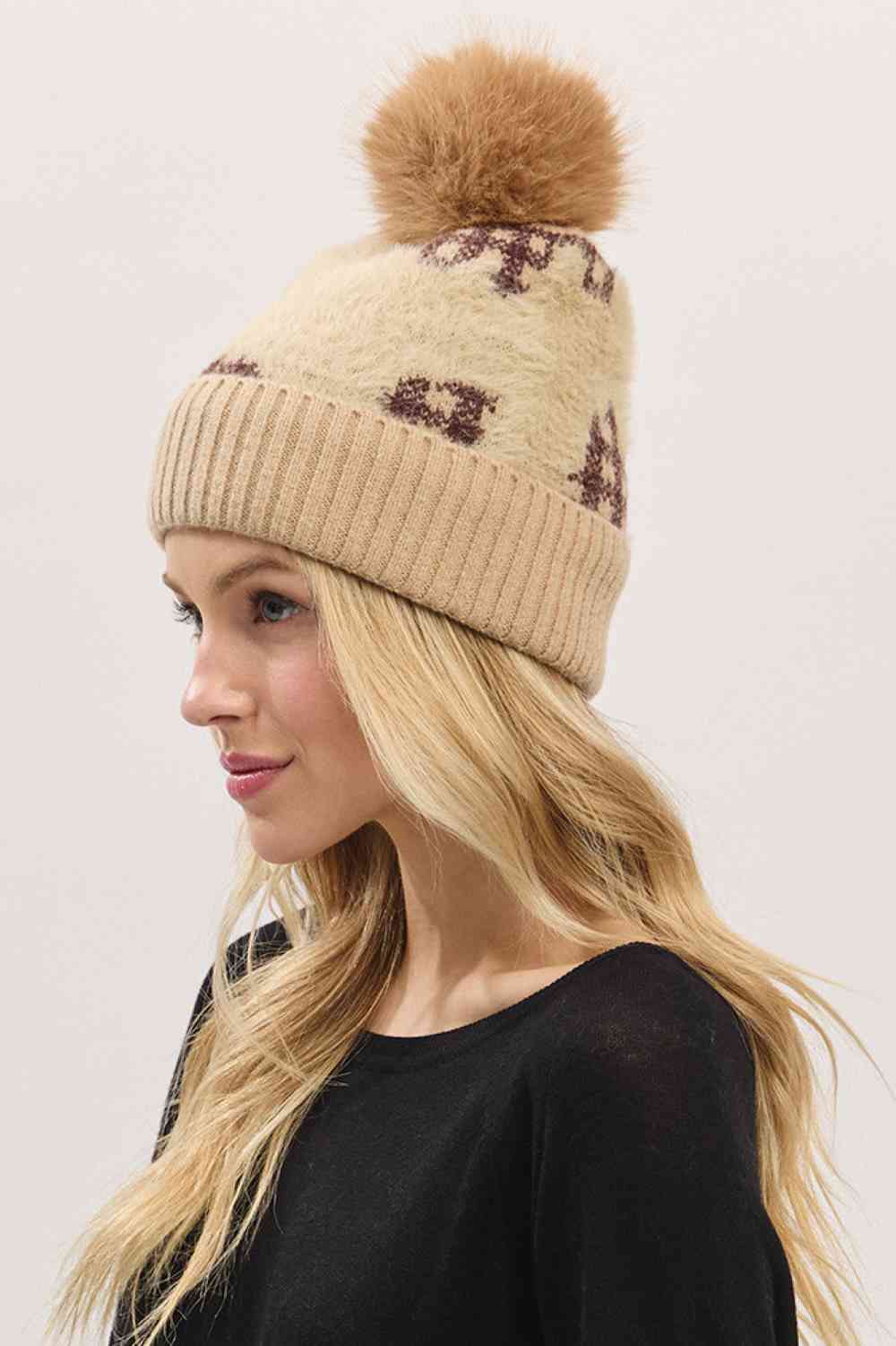 Taupe Plaid Pattern Fur Mixed Fleeced Pom Beanie Hat blends cozy fleece with soft faux-fur accents and a classic plaid design for a warm, stylish winter look. Finished with a plush pom and comfortable stretch fit, it keeps you snug while adding seasonal charm to any cold-weather outfit.