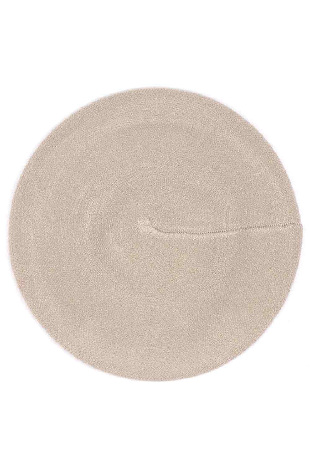 Taupe Embrace effortless style with this stretchy solid color beret. Made from 100% acrylic, it offers a comfortable fit that adapts to your head shape while maintaining its polished appearance. Perfect for adding a touch of sophistication to any season, this versatile beret pairs seamlessly with casual and dressed-up looks alike.