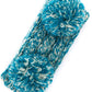 Teal Cozy two-tone kids head wrap featuring a soft fuzzy lining for extra warmth and comfort. Double pom-pom design adds playful style perfect for cold weather. Crafted from 100% acrylic for durability and easy care. One size fits most children. A practical accessory that keeps little ones warm while looking adorable.