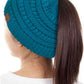 Teal The C.C Solid Color Ponytail Messy Bun Beanie combines comfort with versatility for effortless everyday style. Crafted from 100% soft acrylic, this beanie features an open crown design that accommodates ponytails and messy buns while keeping you warm. The one-size-fits-most construction ensures a secure, flattering fit for virtually anyone. Perfect for casual outings, workouts, or relaxed weekends, this practical accessory transitions seamlessly from season to season.