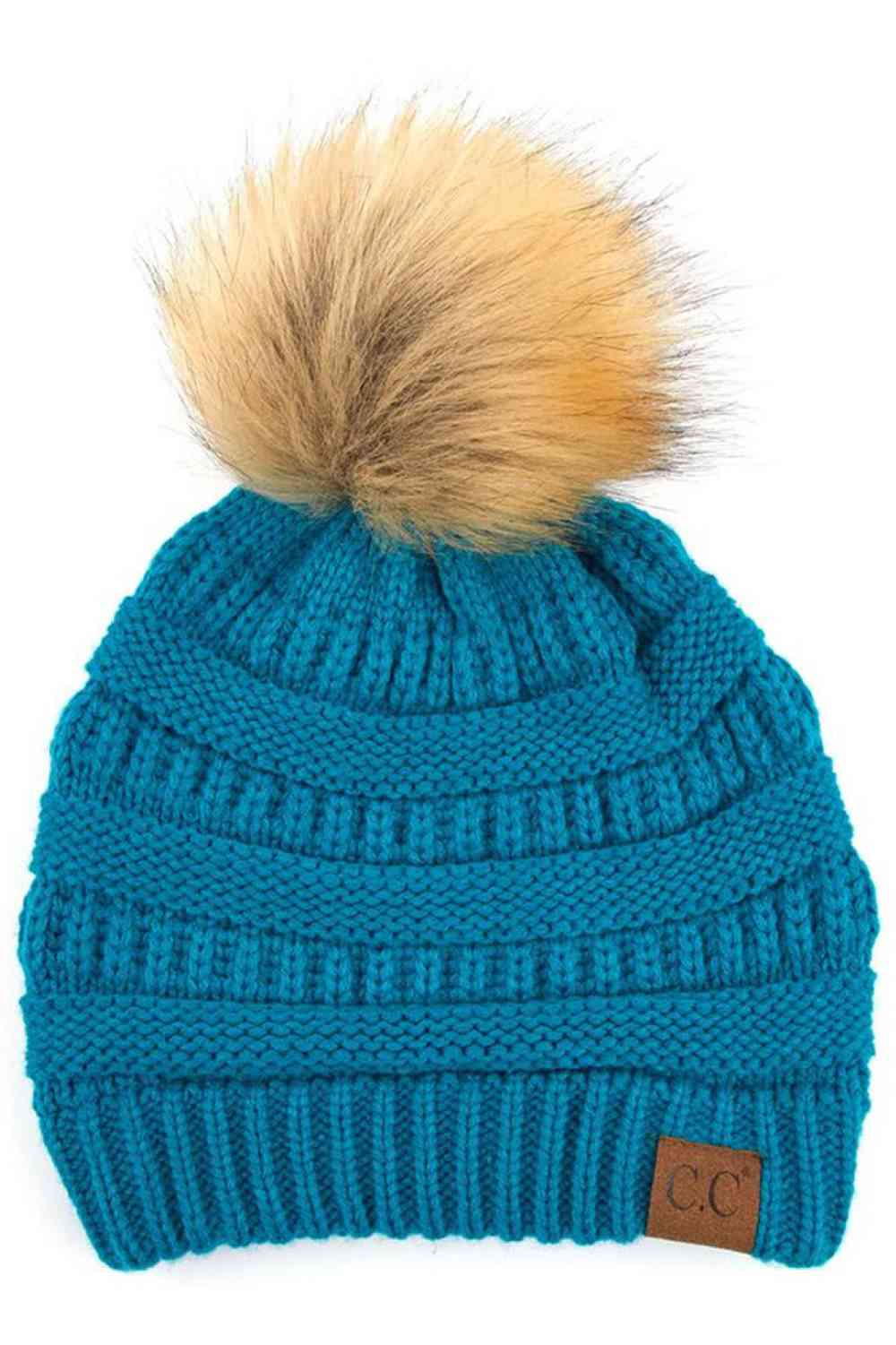 Teal Stay warm and cozy with this classic C.C Pom Pom Knit Beanie, crafted from 100% soft acrylic for all-day comfort. The ribbed knit design adds texture and durability, while the signature pom pom on top brings a playful touch to any winter outfit. One size fits most, making it the perfect accessory for everyone. Ideal for cold weather adventures or casual everyday wear.