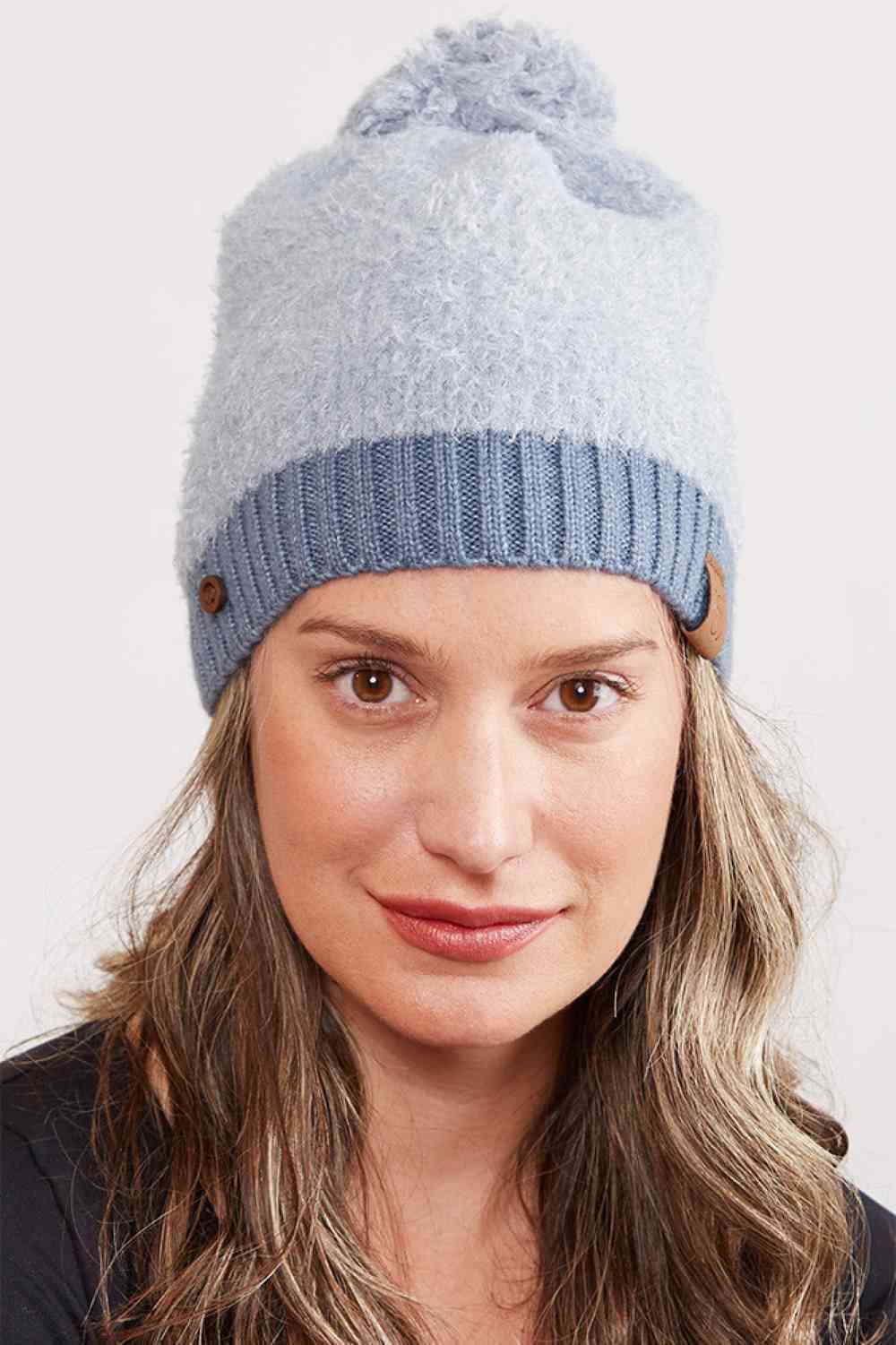 Teal Wrap yourself in warmth with this soft acrylic beanie featuring a ribbed brim, decorative buttons, and a playful pom pom top. Perfect for chilly days, the 100% acrylic construction keeps you cozy without the bulk. A timeless accessory that works with any winter wardrobe.