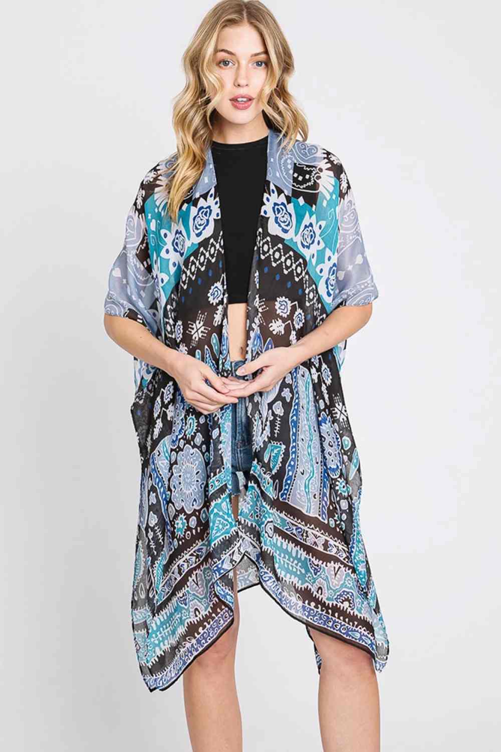 Teal Embrace effortless style with this Geometric Boho Print Kimono. Crafted from lightweight 100% polyester, this versatile piece features eye-catching geometric patterns inspired by bohemian design. Perfect for layering over dresses, swimwear, or casual outfits, it drapes beautifully with a relaxed fit. Measuring 35" x 36", it's designed to flatter most body types. Ideal for beach days, festivals, or adding a boho touch to your everyday wardrobe.