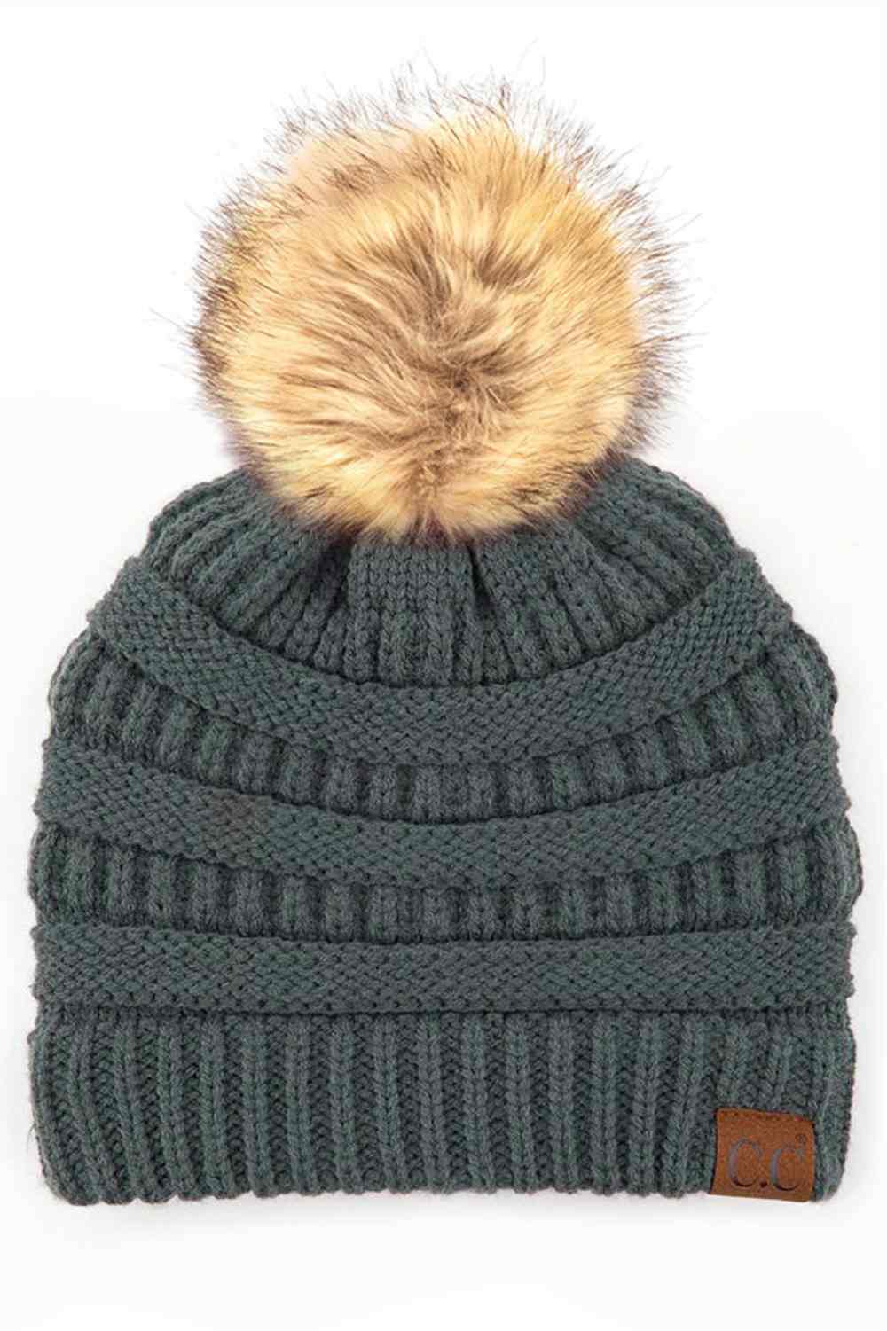 Teal Gray Stay warm and cozy with this classic C.C Pom Pom Knit Beanie, crafted from 100% soft acrylic for all-day comfort. The ribbed knit design adds texture and durability, while the signature pom pom on top brings a playful touch to any winter outfit. One size fits most, making it the perfect accessory for everyone. Ideal for cold weather adventures or casual everyday wear.
