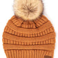 Toast Almond Stay warm and cozy with this classic C.C Pom Pom Knit Beanie, crafted from 100% soft acrylic for all-day comfort. The ribbed knit design adds texture and durability, while the signature pom pom on top brings a playful touch to any winter outfit. One size fits most, making it the perfect accessory for everyone. Ideal for cold weather adventures or casual everyday wear.