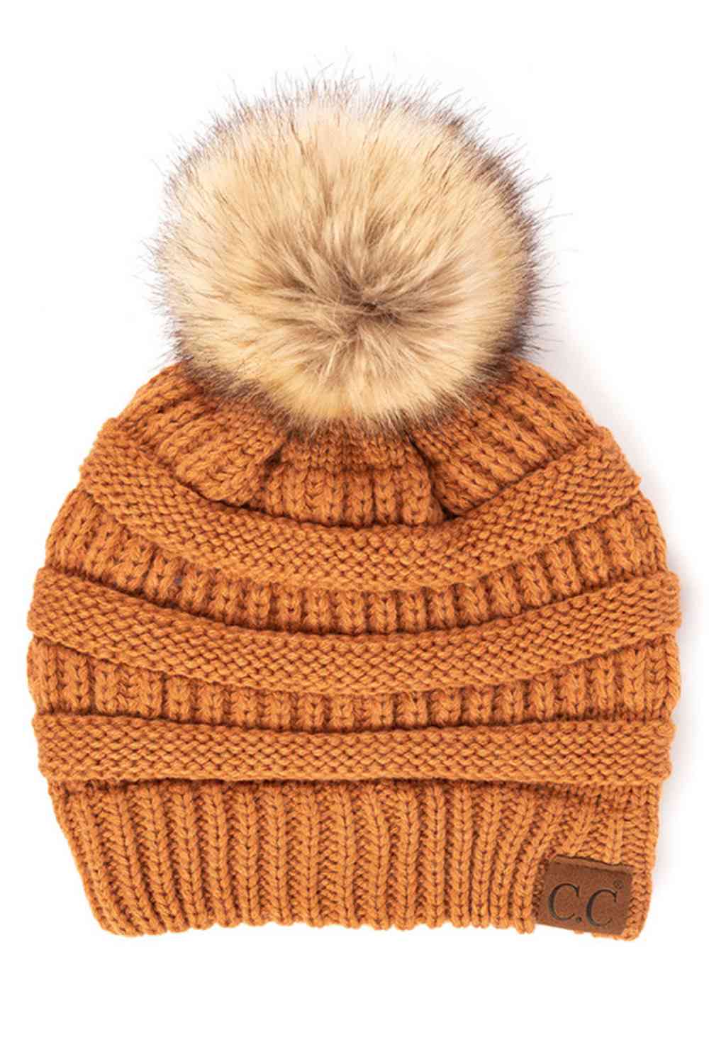 Toast Almond Stay warm and cozy with this classic C.C Pom Pom Knit Beanie, crafted from 100% soft acrylic for all-day comfort. The ribbed knit design adds texture and durability, while the signature pom pom on top brings a playful touch to any winter outfit. One size fits most, making it the perfect accessory for everyone. Ideal for cold weather adventures or casual everyday wear.