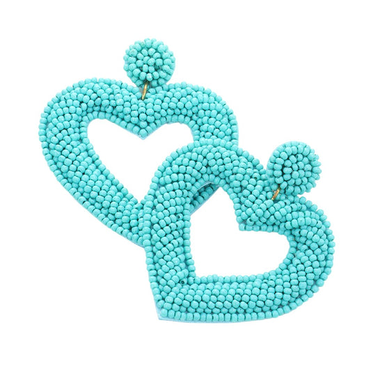 Turquoise Beaded Open Heart Drop Earrings! Made with stunning beads, these earrings add a touch of elegance to any outfit. Their open heart design symbolises love and vulnerability, making them the perfect gift for a loved one. Upgrade your jewelry collection with these beautiful and timeless earrings.
