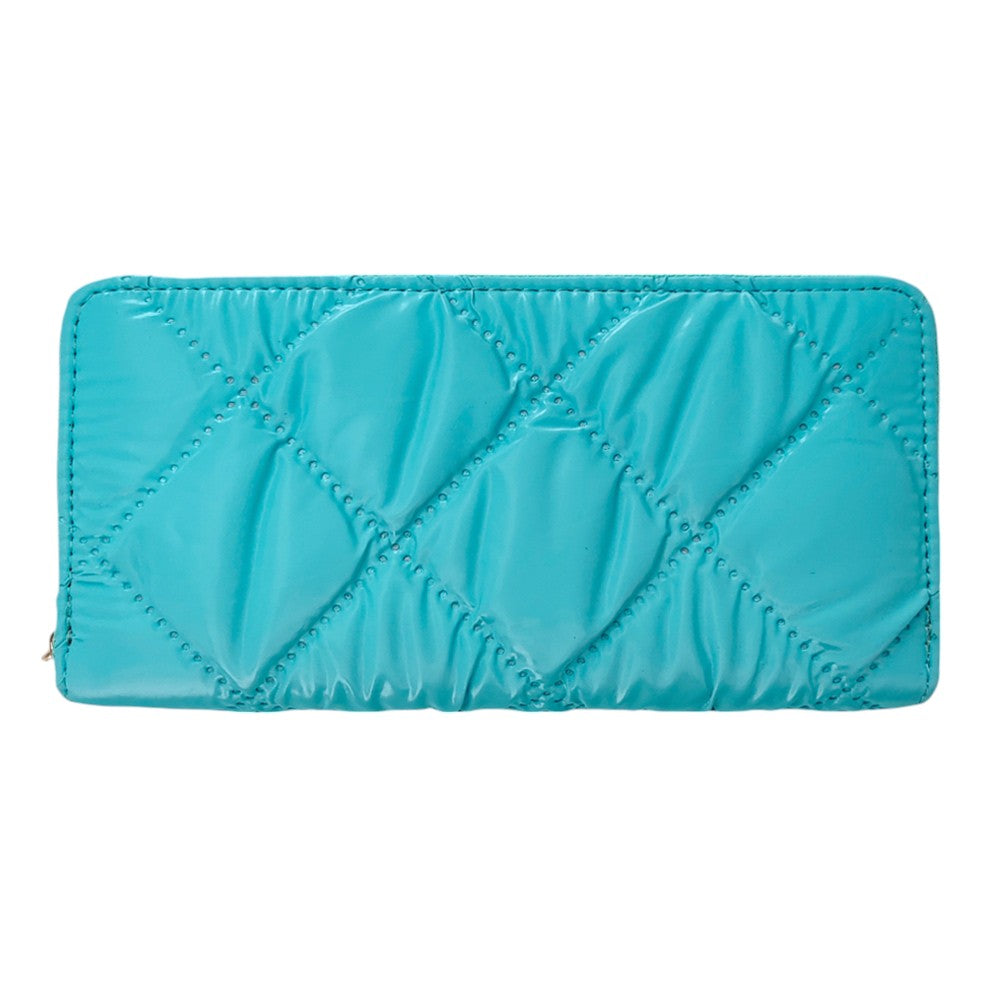 Turquoise Shiny Faux Leather Padded Wallet with Wristlet offers a sleek and stylish solution for storing your essentials. Its shiny faux leather material adds a touch of sophistication, while the padded design keeps your valuables safe. The attached wristlet also provides convenience and hands-free carrying. 