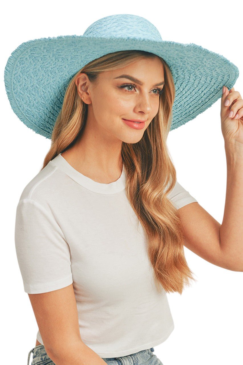 Turquoise Solid Floppy Sun Hat provides superior UV protection while maintaining a timeless silhouette. Constructed with durable materials that retain shape throughout wear, it features an adjustable interior band for a secure fit across head sizes. The lightweight design ensures comfort during extended outdoor activities, making it an essential accessory for both sun protection and refined style.
