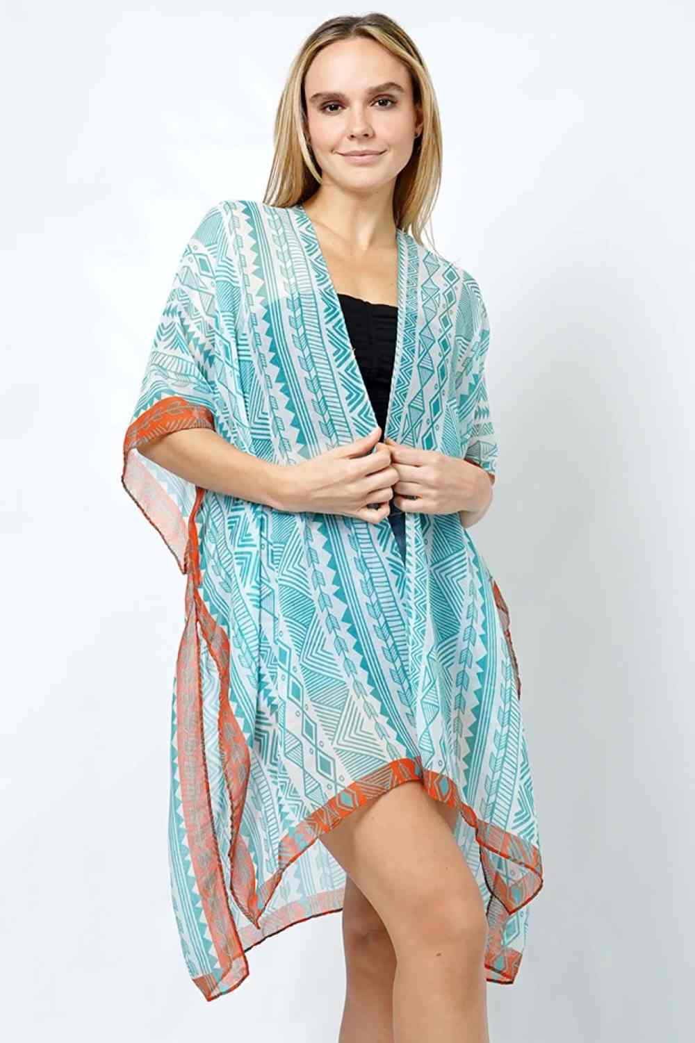 Turquoise Embrace effortless elegance with this Ethnic Pattern Print Kimono. Featuring a striking ethnic-inspired design, this lightweight piece drapes beautifully over any outfit for an instant style upgrade. Crafted from 100% polyester for easy care and durability, it offers comfortable wear throughout the day. With a generous 35" length, it provides excellent coverage and movement. Perfect for layering over dresses, casual wear, or beach outings.