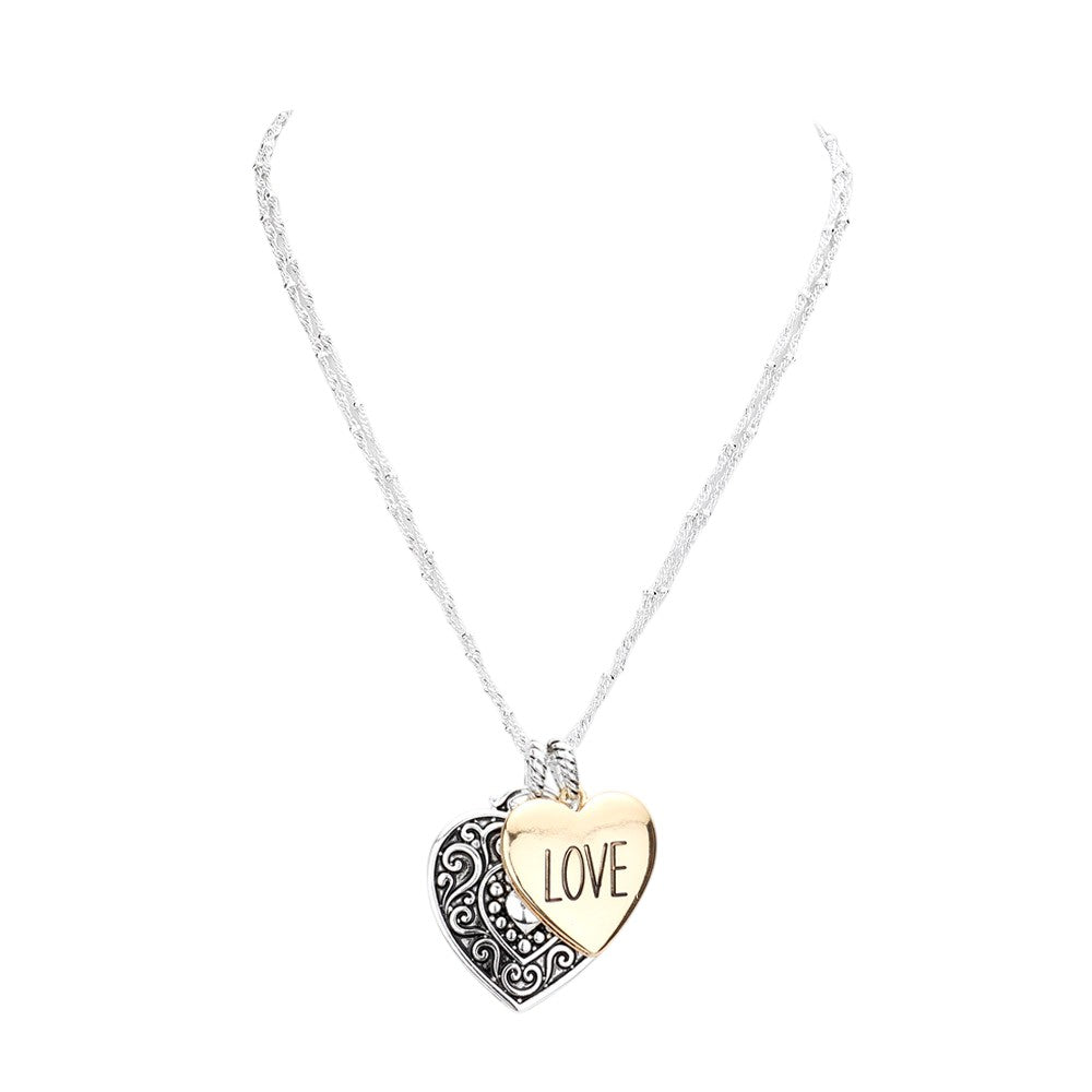 Two Tone LOVE Antique Metal Heart Pendant Necklace is a charming piece of jewelry that adds a vintage touch to any outfit. Crafted with antique metal, the heart pendant is an elegant and delicate design. The perfect gift to express your love.