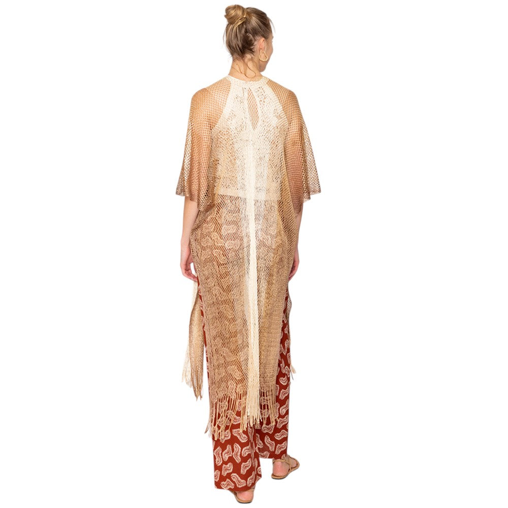 Gold Two Tone Lurex Kimono Poncho is a versatile and stylish addition to any wardrobe. Made with a unique Lurex fabric, it adds a touch of shimmer to your outfit. Its kimono design offers a comfortable and flattering fit, making it suitable for any body type. Perfect for adding a pop of color and sparkle to your outfit. 