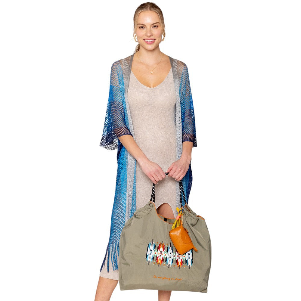 Turquoise Two Tone Lurex Kimono Poncho is a versatile and stylish addition to any wardrobe. Made with a unique Lurex fabric, it adds a touch of shimmer to your outfit. Its kimono design offers a comfortable and flattering fit, making it suitable for any body type. Perfect for adding a pop of color and sparkle to your outfit. 