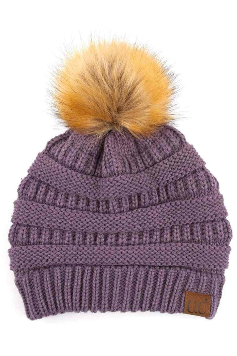 Violet Stay warm and cozy with this classic C.C Pom Pom Knit Beanie, crafted from 100% soft acrylic for all-day comfort. The ribbed knit design adds texture and durability, while the signature pom pom on top brings a playful touch to any winter outfit. One size fits most, making it the perfect accessory for everyone. Ideal for cold weather adventures or casual everyday wear.