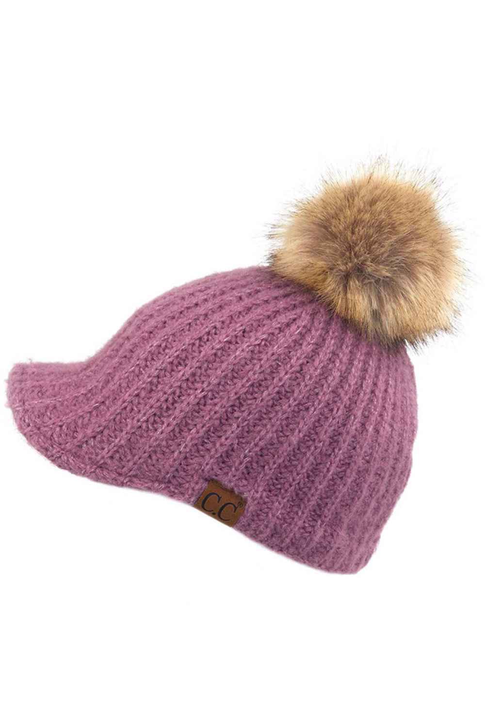 Purple Stay cozy with this knitted brim beanie featuring a plush pom pom detail. Crafted from a soft blend of 75% acrylic, 22% polyester, and 3% spandex, this winter essential delivers warmth and comfort in a versatile style. Available in nine rich colors including Beige, Berry, Dark Denim, Heather Gray, Ivory, Pistachio, Rose, Steel Blue, and Violet Purple. The ribbed knit construction and faux fur pom add texture and visual interest to any cold-weather outfit. Hand wash and lay flat to dry for lasting qua