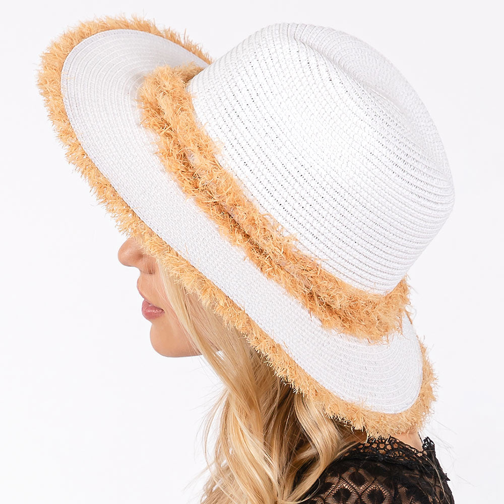 White Frayed Band and Trip Straw Sun Hat combines style and practicality. The frayed band adds a touch of texture, while the trip straw material provides superior sun protection. Perfect for a day at the beach or a stroll in the park, this hat will keep you both fashionable and protected.