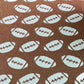 White Reversible Football Patterned Throw Blanket, is the perfect addition to your home décor and it's great for football fans! It offers two different football-inspired patterns. Enjoy cozy nights in with this reversible blanket and you won't have to miss any of the action on the field. Ideal gift for football lovers.