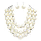 Triple Layered Chunky Pearl Necklace is a gorgeous addition to any outfit. Made with high-quality pearls in a unique triple layer design, this necklace adds a touch of elegance and sophistication to your look. Its chunky style makes a statement while still remaining versatile for any occasion. Upgrade your jewelry collection with this must-have piece. 