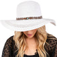 White Wide Brim Straw Sun Hat with Evil Eye and Multi Design Band offers stylish sun protection with its unique evil eye and multi-design band. Its wide brim provides ample shade while the evil eye brings a touch of charm. Stay safe from the sun while adding a fashionable touch to your outfit. 