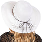 White Wide Brim Straw Sun Hat with Evil Eye and Multi Design Band offers stylish sun protection with its unique evil eye and multi-design band. Its wide brim provides ample shade while the evil eye brings a touch of charm. Stay safe from the sun while adding a fashionable touch to your outfit. 