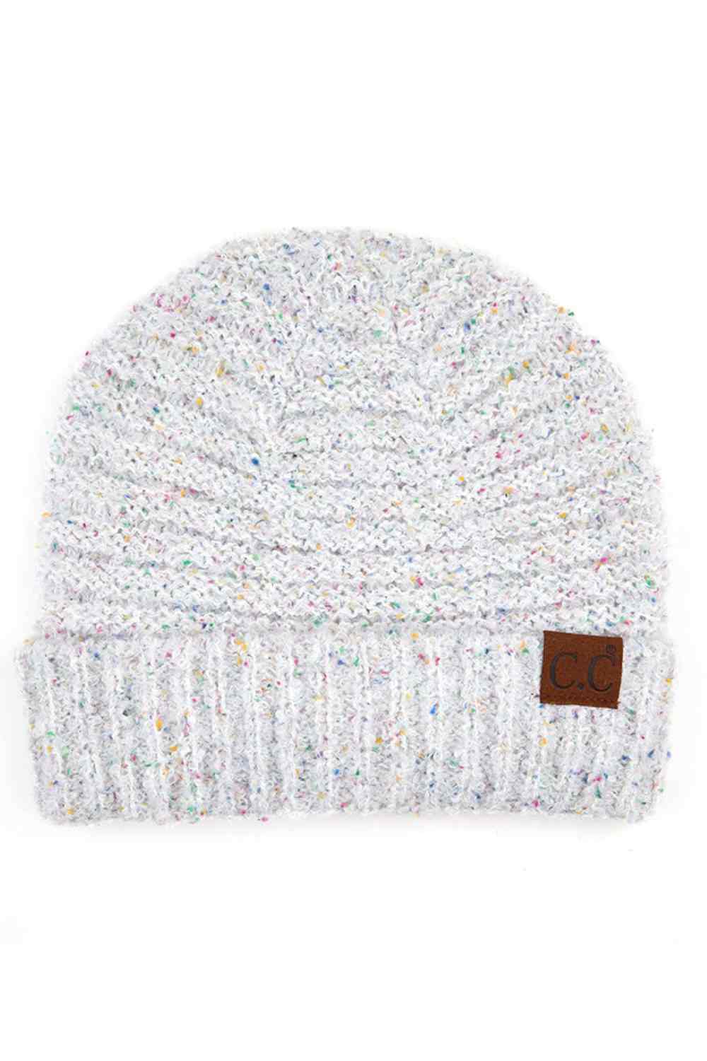 White Elevate your winter wardrobe with this C.C Confetti Boucle Yarn Beanie, crafted from a premium blend of 95% polyester and 5% cotton. The textured boucle yarn creates visual interest and dimension, making it the perfect accessory to complement any outfit.
