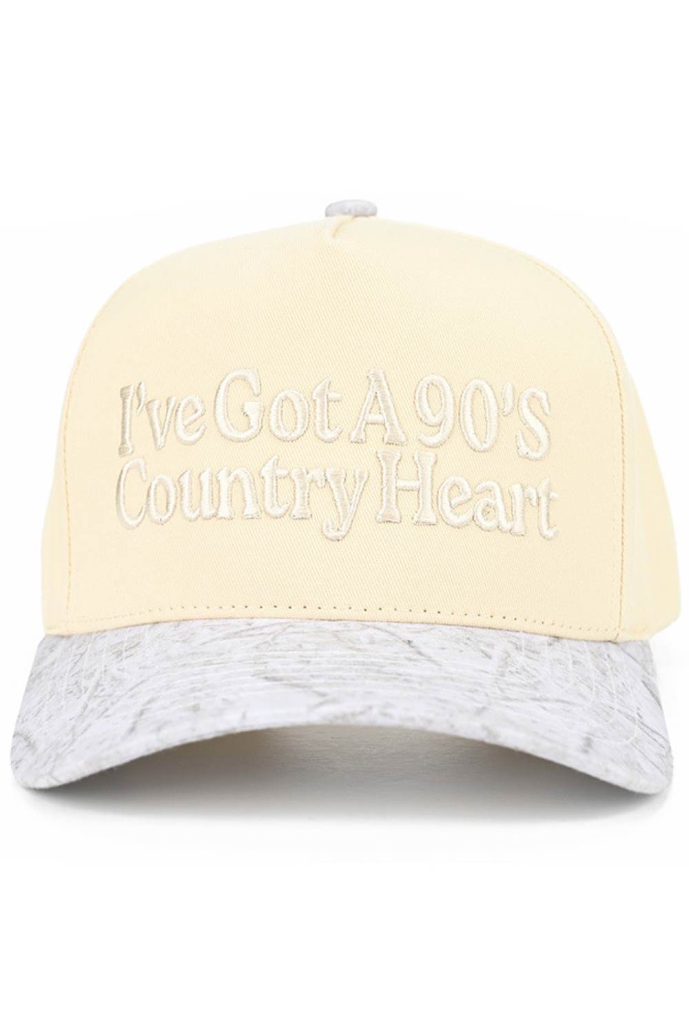 White Camo Embrace your country spirit with this charming C.C trucker hat featuring an embroidered "I'VE GOT A 90'S COUNTRY HEART" design. Crafted from 100% cotton, this two-tone baseball cap delivers comfort and style for everyday wear. The adjustable snap back closure ensures a perfect fit for most head sizes, with a 22.5" circumference. Whether you're a country music fan or love vintage-inspired fashion, this hat adds authentic flair to any outfit. Made in Vietnam with quality construction that lasts.