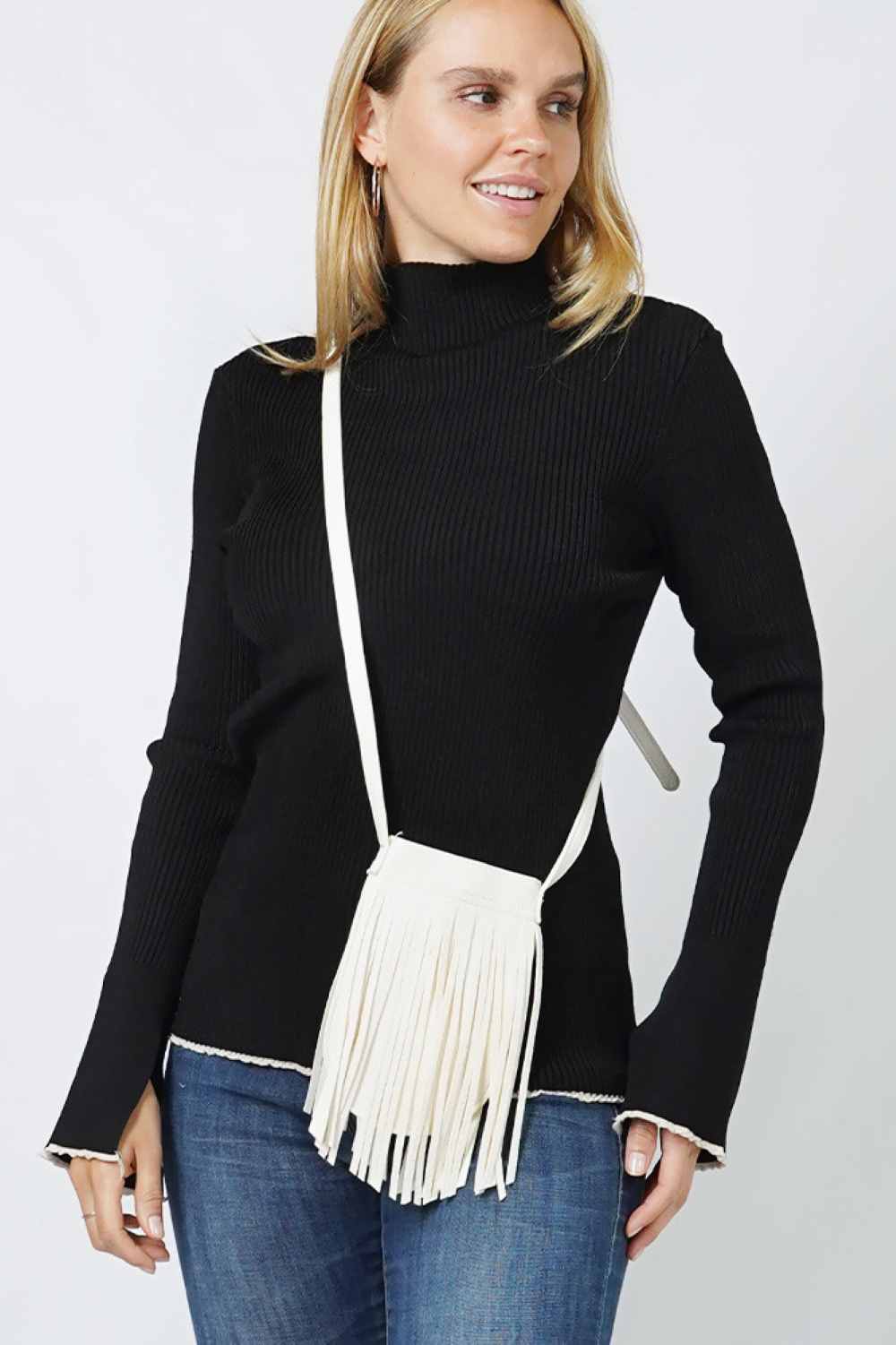 White Compact and stylish, this fringe mini crossbody bag is the perfect accessory for on-the-go moments. Crafted from durable 100% polyester, it features playful fringe detailing that adds movement and personality to any outfit. The adjustable crossbody strap keeps your hands free while you navigate your day. One size fits all, making it an easy grab-and-go essential for casual outings, festivals, or weekend adventures.