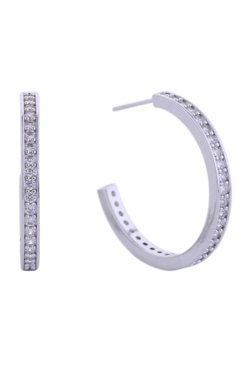 White Gold Elevate your everyday look with these stunning 14K Daily CZ Pave Hoop Post Earrings. Crafted from hypoallergenic brass, they feature brilliant cubic zirconia pavé detailing that catches the light beautifully. Perfect for sensitive skin, these earrings are lead and nickel compliant, ensuring comfort and safety for all-day wear. The classic hoop silhouette with post backing offers timeless style and secure fit. A versatile essential that transitions seamlessly from casual to dressed-up occasions.