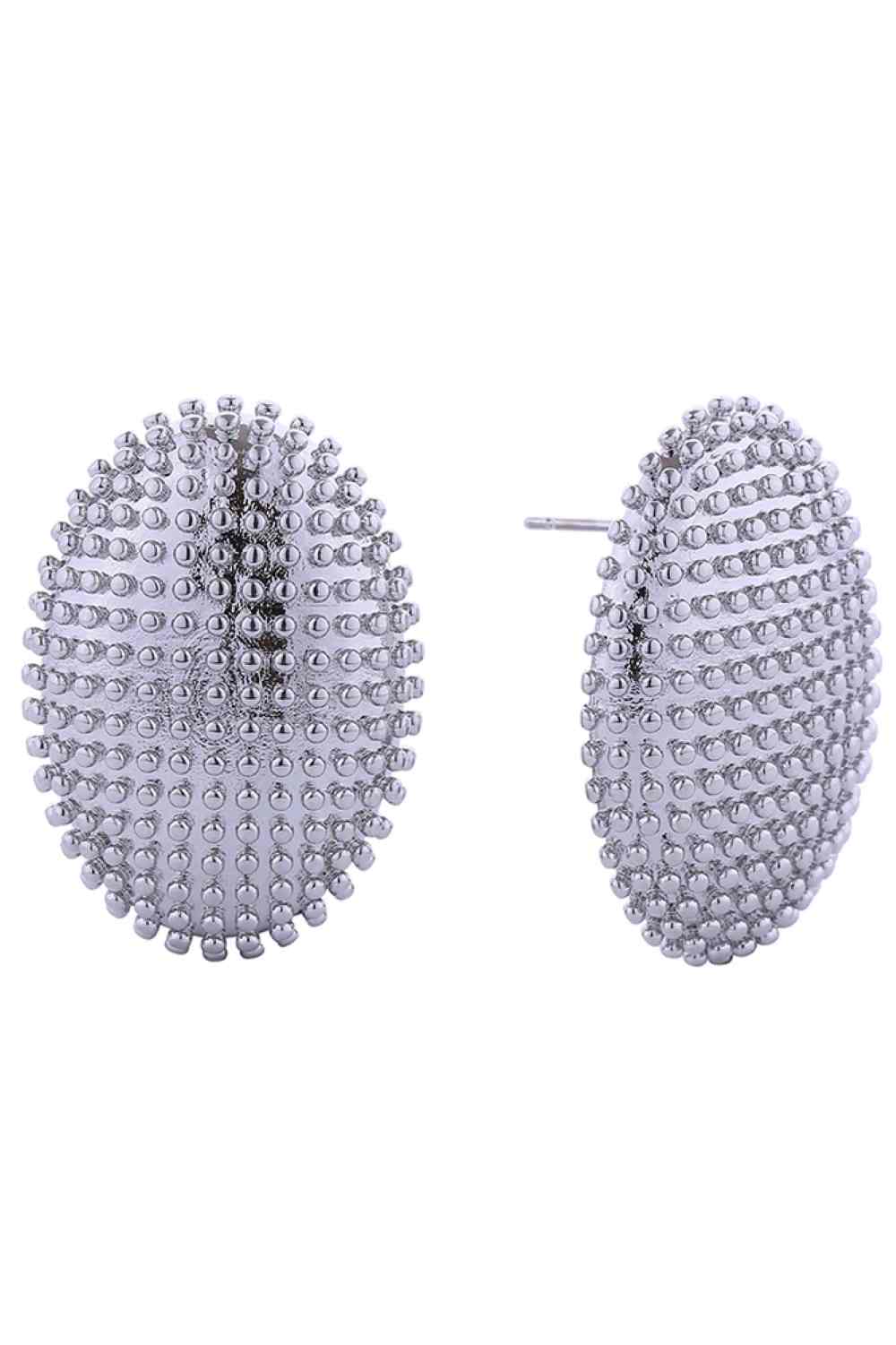 White Gold Elegant oval post earrings crafted in brass with 14K gold and white gold dipping. Measuring 3.1cm in diameter, these hypoallergenic earrings are perfect for sensitive skin. Lead and nickel compliant for safe, everyday wear. Expertly made in Korea, they combine timeless style with quality craftsmanship.