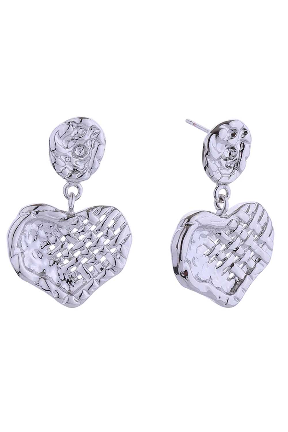 White Gold Elegant heart-shaped drop earrings crafted in brass with a hypoallergenic finish. Each earring measures 3.3cm in diameter, offering a delicate yet noticeable presence. Designed with post backs for secure, comfortable wear. Lead and nickel compliant, making them safe for sensitive skin. Perfect for everyday elegance or special occasions.