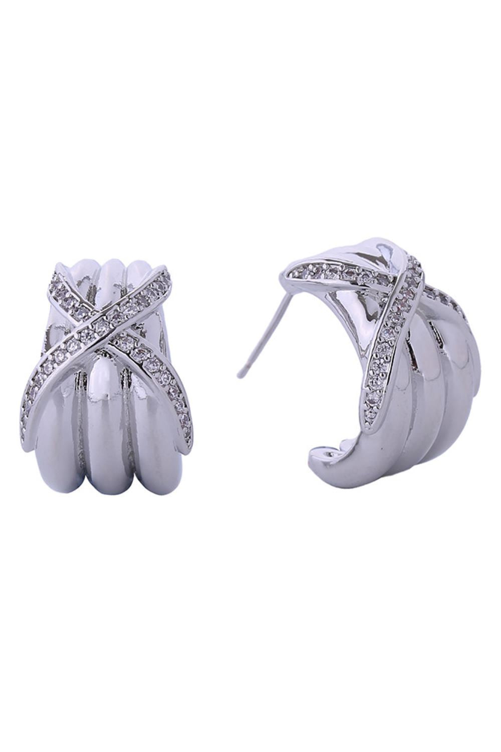 White Gold Elegant crossover design meets everyday wearability in these stunning post earrings. Crafted from brass with 14K gold and white gold dipping, they feature sparkling cubic zirconia pavé detailing that catches the light beautifully. At 2.3cm, they're the perfect size for a refined, understated look. Hypoallergenic construction makes them ideal for sensitive ears, while lead and nickel compliance ensures safety and peace of mind.