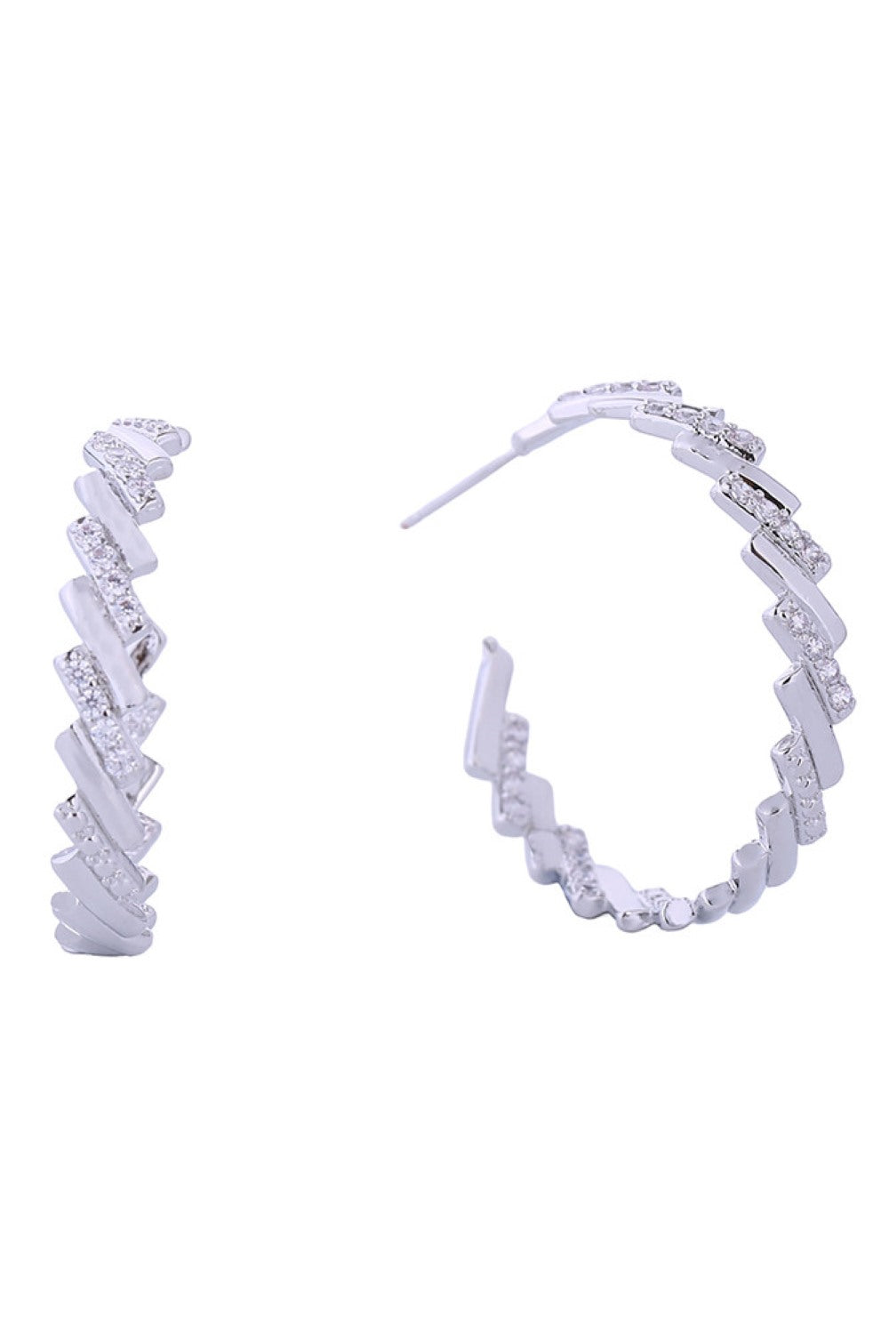 White Gold Elevate your everyday elegance with these stunning 14K Gold/White Gold dipped crystal baguette hoop earrings. Crafted with precision in Korea, these 3.5cm hoops feature brilliant cubic zirconia baguettes that catch the light beautifully. The hypoallergenic brass construction makes them perfect for sensitive skin, while meeting all lead and nickel compliance standards.