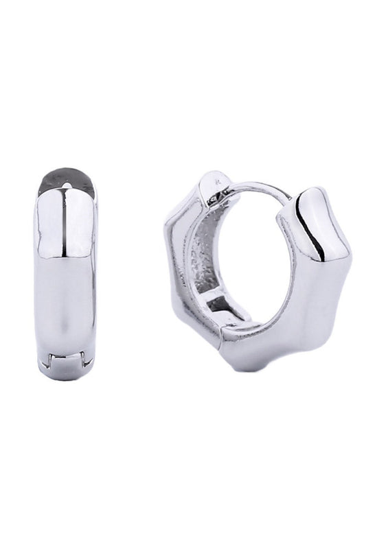 White Gold Delicate and timeless, these 14K gold dipped huggie hoop earrings offer everyday elegance in a compact 1.4cm diameter. Crafted from hypoallergenic brass, they're gentle on sensitive skin while delivering a luxurious gold finish. Lead and nickel compliant for peace of mind. Perfect for layering or wearing solo, these versatile hoops complement any style.