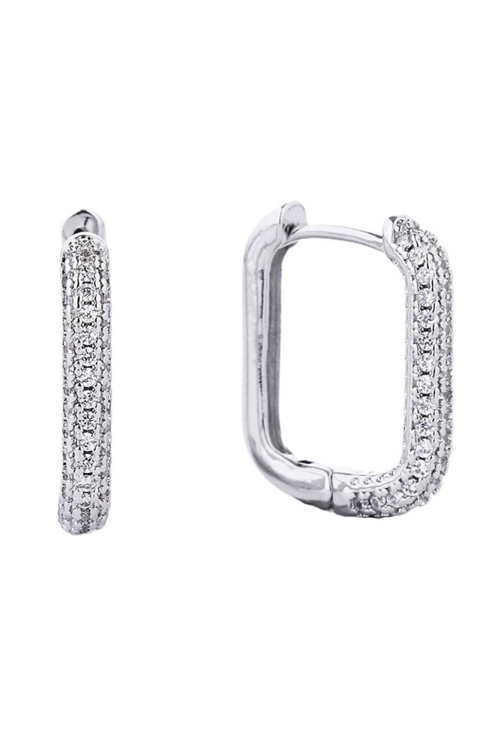 White Gold Elevate your everyday elegance with these stunning 14K Gold and White Gold dipped huggie hoops, featuring brilliant cubic zirconia pavé detailing. Crafted from hypoallergenic brass, these versatile earrings are perfect for sensitive skin and designed to complement any look. With a comfortable 2.11cm diameter, they sit beautifully close to the ear for a modern, polished aesthetic. Lead and nickel compliant, these hoops deliver luxury without compromise ideal for layering or wearing solo.