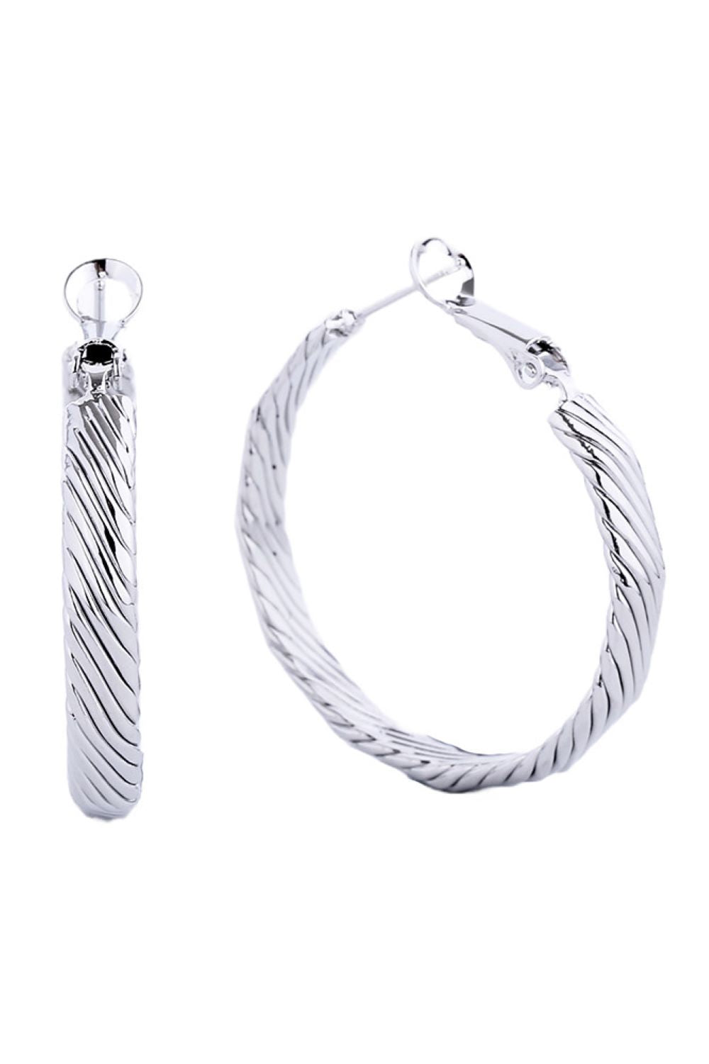 White Gold Elegant hoop earrings crafted from hypoallergenic brass with a luxurious 14K gold and white dip finish. Featuring a secure omega closure for all-day wear, these 3.5cm diameter hoops offer timeless style with modern comfort. Lead and nickel compliant, making them perfect for sensitive skin. A versatile essential that transitions effortlessly from casual to formal occasions.