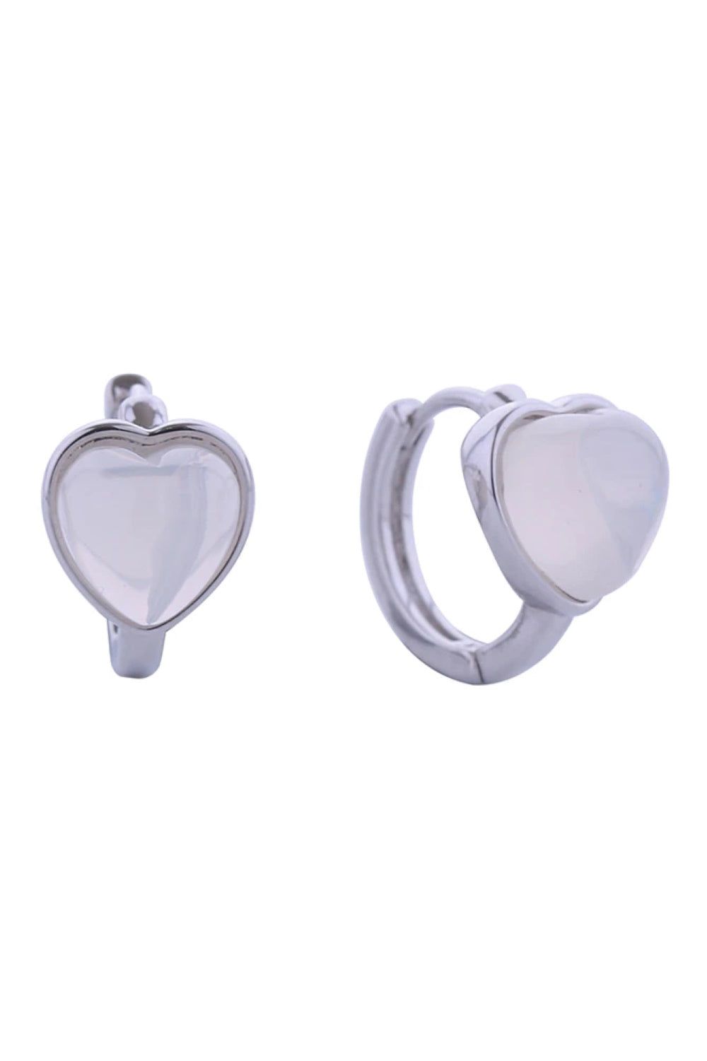 White Gold Embrace timeless elegance with these 14K gold and white gold dipped heart huggie earrings. Crafted from hypoallergenic brass with captivating cat eye stone details, they're designed for sensitive skin and everyday comfort. Measuring 1.7cm in diameter, these petite huggies sit close to the ear for a refined, understated look.