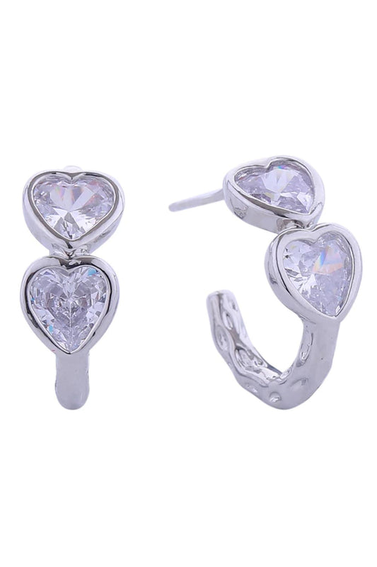 White Gold Elegant 14K duo heart cubic zirconia post earrings crafted from hypoallergenic brass. Each earring features a delicate 1.8cm diameter design with sparkling CZ stones that catch the light beautifully. Lead and nickel compliant for safe, comfortable everyday wear. Perfect for adding a touch of sophistication to any look.
