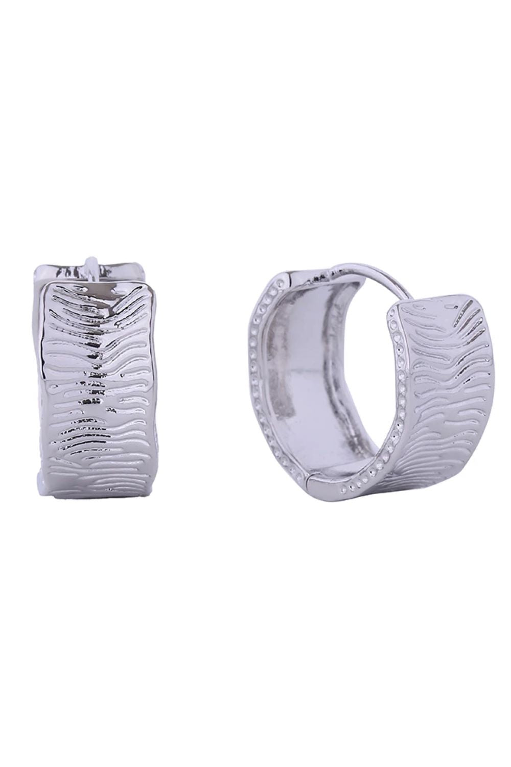 White Gold Delicate 14K gold and white gold dipped huggie hoop earrings crafted from hypoallergenic brass. Each pair features intricate engraving detail and measures 2cm in diameter for a subtle, everyday look. Lead and nickel compliant for sensitive skin. Expertly made in Korea.