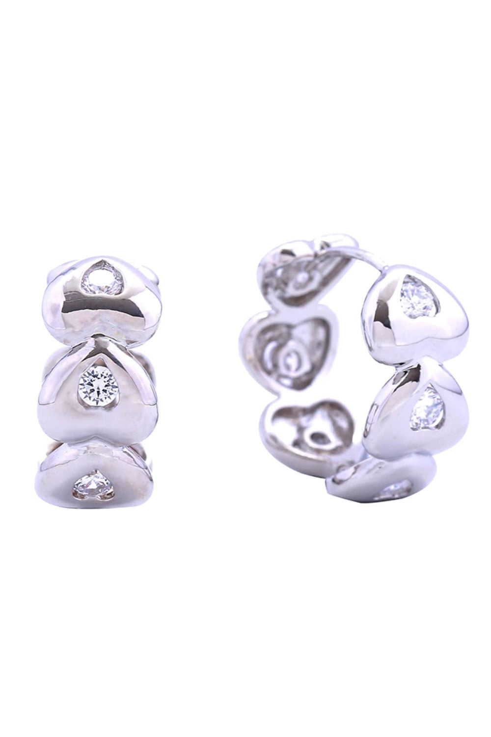 White Gold Elegant 14K eternity heart huggie earrings crafted from hypoallergenic brass with sparkling cubic zirconia stones. These petite 2.2cm diameter earrings offer timeless sophistication with everyday wearability. Lead and nickel compliant for sensitive skin. Perfect for layering or wearing solo, these versatile huggies add a touch of luxury to any look.
