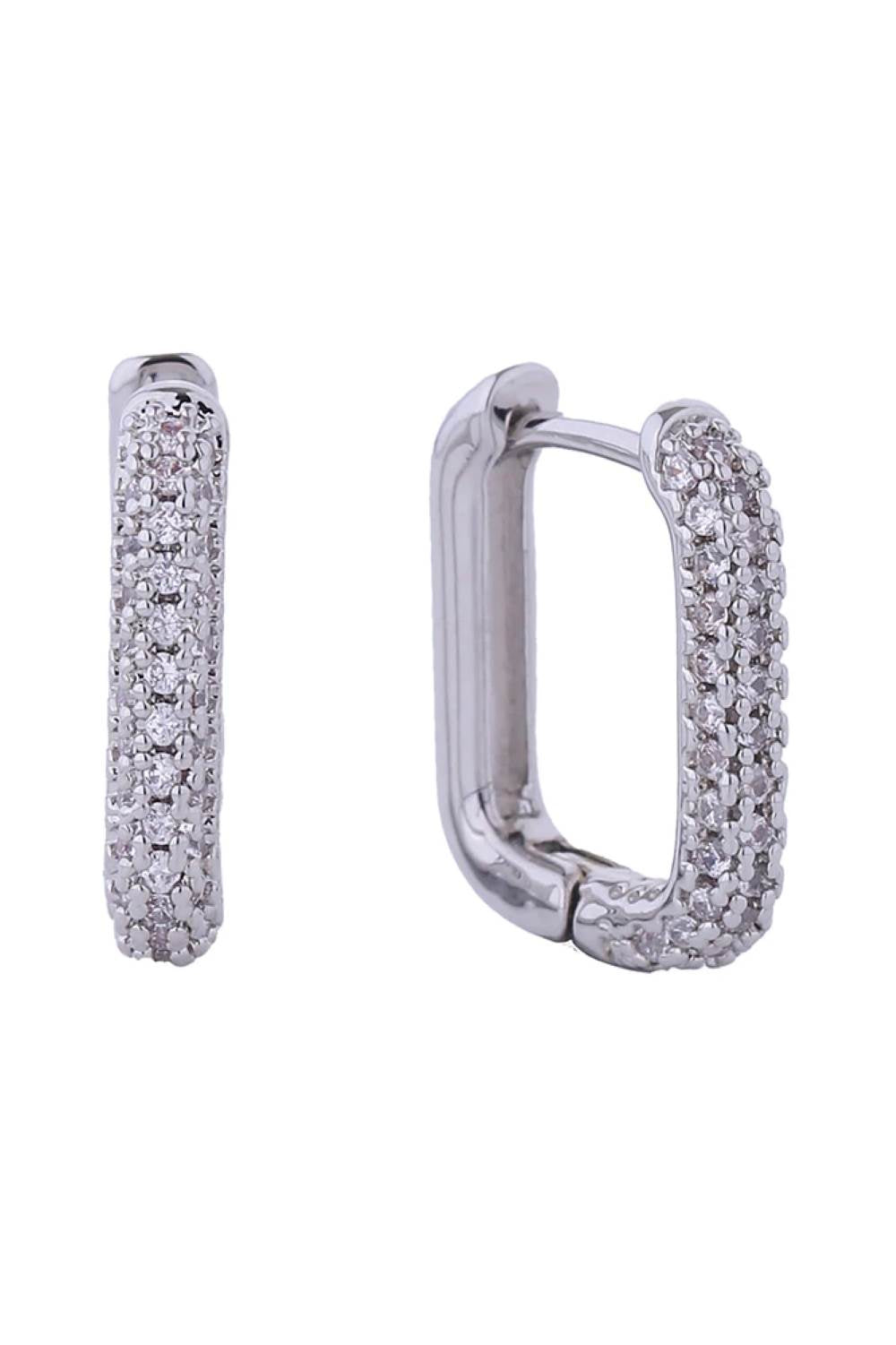 White Gold Elevate your everyday look with these stunning 14K Gold/White Gold dipped huggie earrings. Crafted from hypoallergenic brass and adorned with sparkling cubic zirconia pavé detailing, these delicate hoops offer timeless elegance with a modern edge. At just 1.4cm in diameter, they sit perfectly close to the ear for a refined, understated aesthetic. Designed with sensitive skin in mind, they're lead and nickel compliant for worry-free wear.