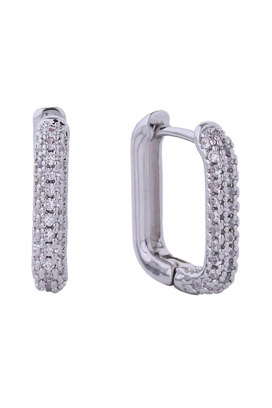 White Gold Elevate your everyday look with these stunning 14K Gold/White Gold dipped huggie earrings. Crafted from hypoallergenic brass and adorned with sparkling cubic zirconia pavé detailing, these delicate hoops offer timeless elegance with a modern edge. At just 1.4cm in diameter, they sit perfectly close to the ear for a refined, understated aesthetic. Designed with sensitive skin in mind, they're lead and nickel compliant for worry-free wear.
