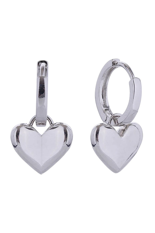 White Gold Delicate heart-shaped drops suspended from classic huggie earrings, crafted in lustrous 14K gold or white gold plating over hypoallergenic brass. Each earring measures 1.5cm for an elegant, understated look that works for everyday wear or special occasions. Lead and nickel compliant for sensitive skin. Expertly made in Korea with quality craftsmanship you can trust.