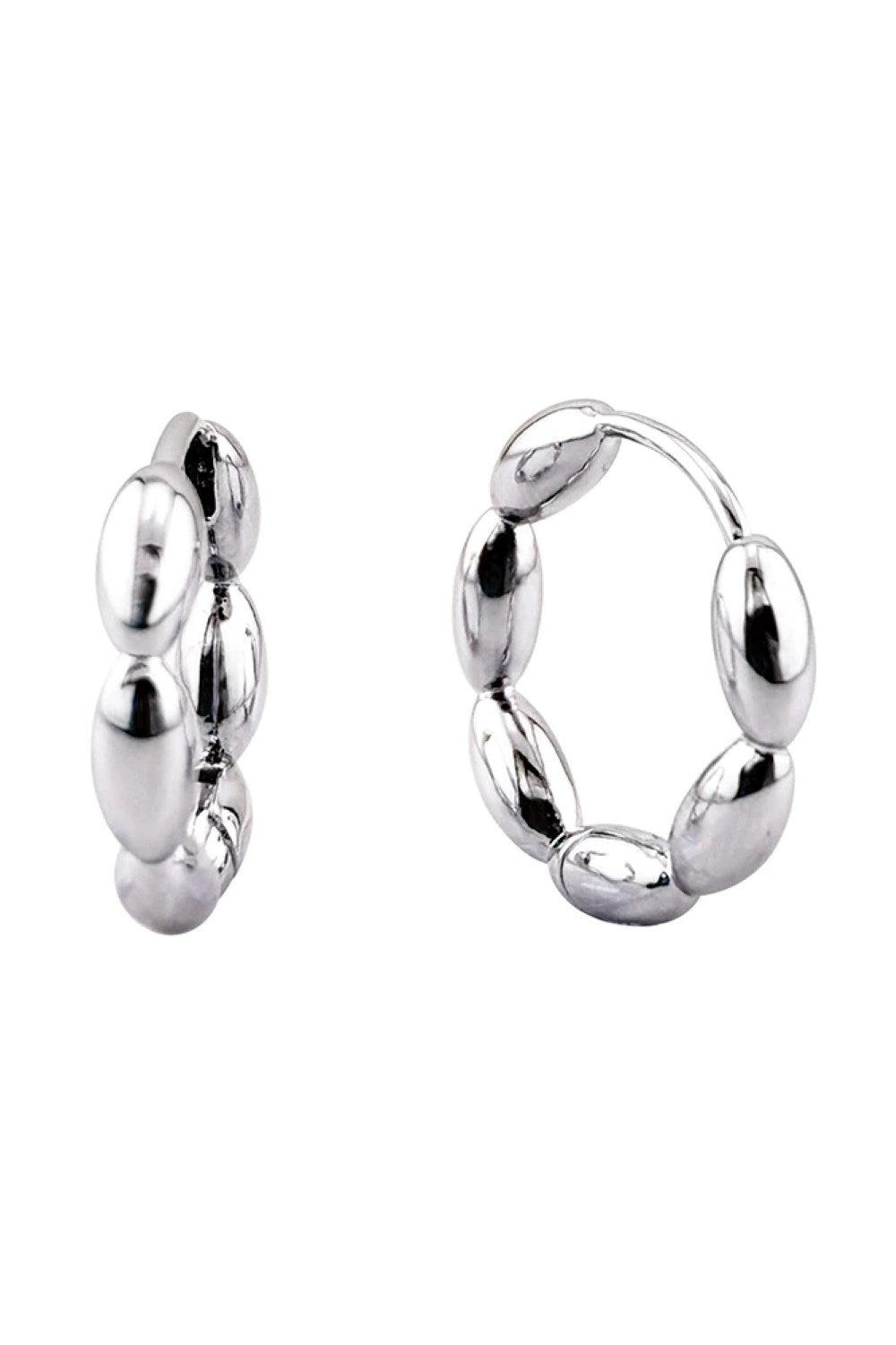 White Gold Delicate 14K link beans design meets everyday elegance in these huggie hoop earrings. Crafted from hypoallergenic brass, they're gentle on sensitive skin while delivering timeless style. At 1.8cm diameter, they sit perfectly close to the ear for a refined, understated look. Lead and nickel compliant for peace of mind. Perfect for layering or wearing solo.