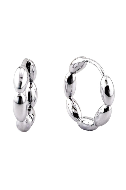 White Gold Delicate 14K link beans design meets everyday elegance in these huggie hoop earrings. Crafted from hypoallergenic brass, they're gentle on sensitive skin while delivering timeless style. At 1.8cm diameter, they sit perfectly close to the ear for a refined, understated look. Lead and nickel compliant for peace of mind. Perfect for layering or wearing solo.