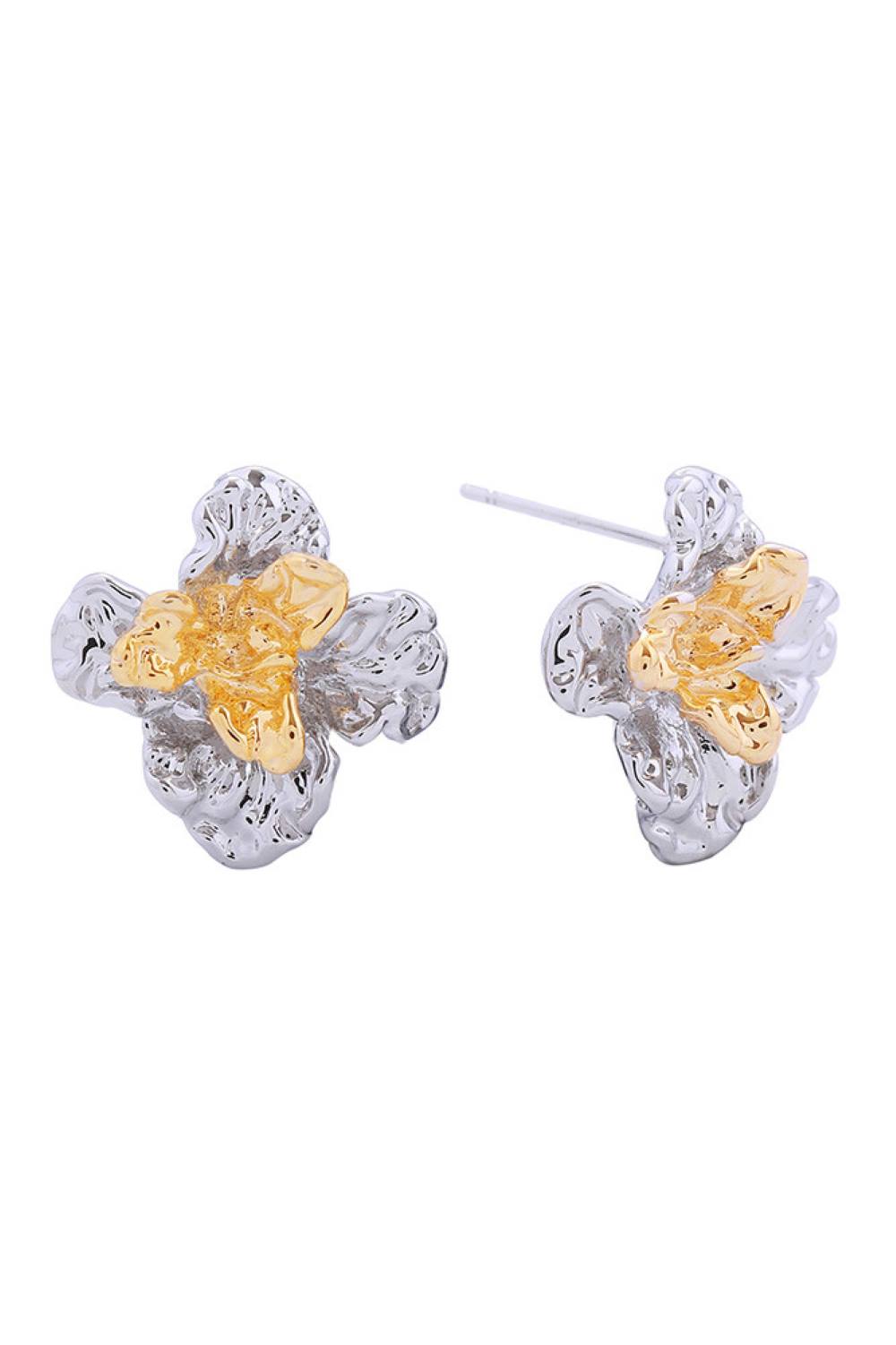 White Gold Delicate magnolia blooms captured in timeless post earrings. Crafted from brass with a luxurious 14K gold and white dip finish, these hypoallergenic studs are perfect for sensitive skin. At 1.8cm in diameter, they offer an elegant, understated presence. Lead and nickel compliant for peace of mind. A versatile addition to any jewelry collection.