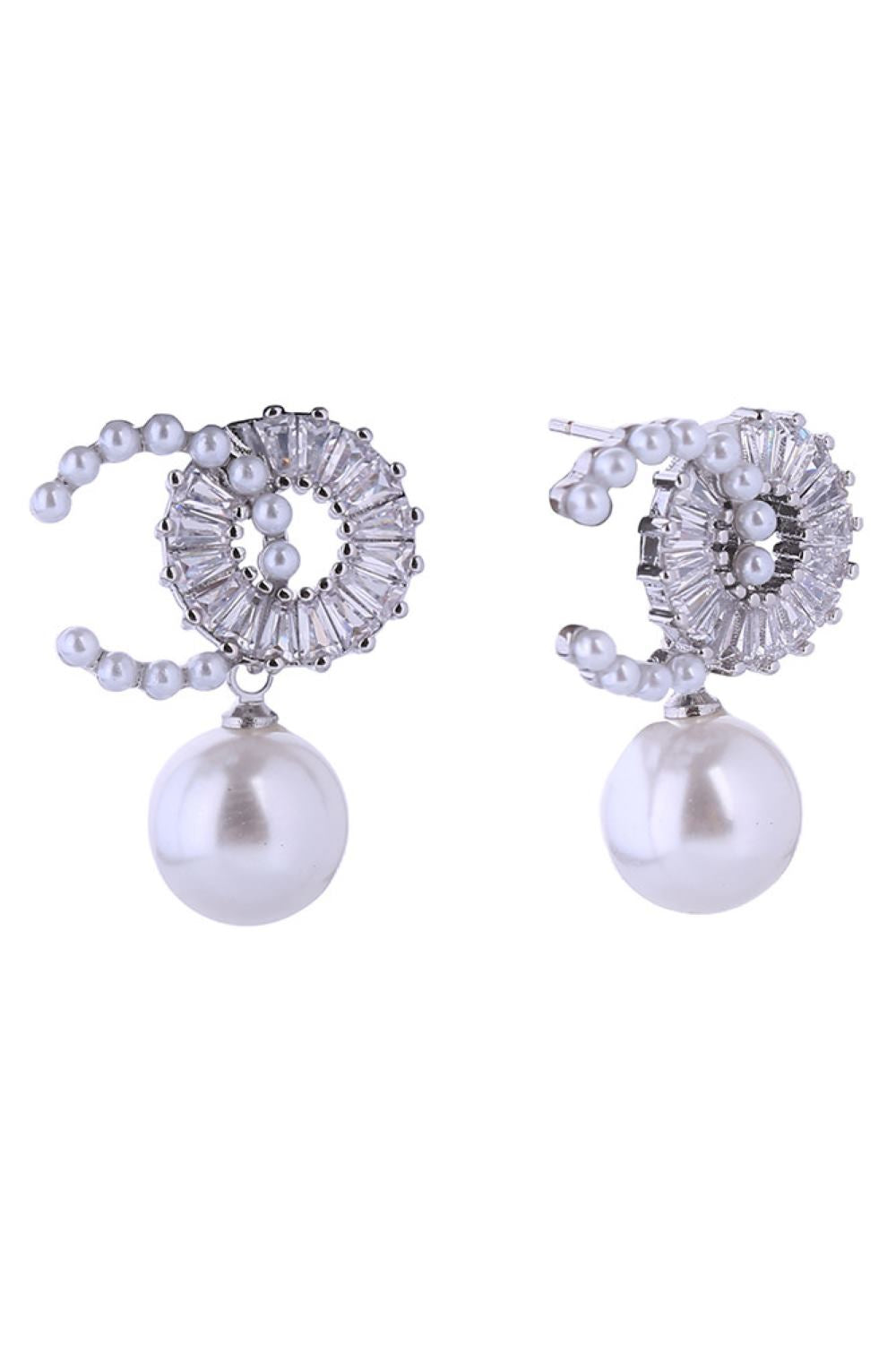 White Gold Elegant pearl drop earrings crafted with 14K gold and white gold dipping for a luxurious finish. Featuring lustrous O-C pearls paired with sparkling cubic zirconia accents, these hypoallergenic posts are gentle on sensitive ears. Measuring 2cm, they offer the perfect balance of sophistication and wearability. 